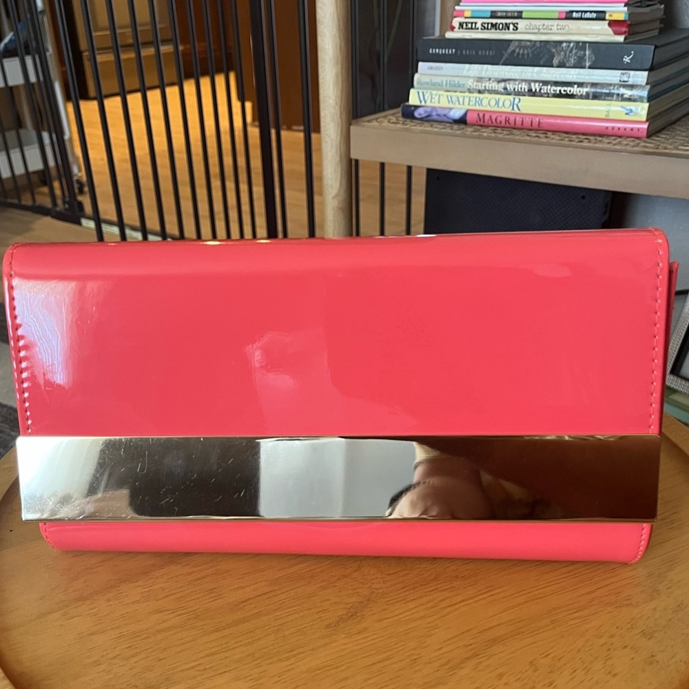 ALDO coral patent leather clutch
